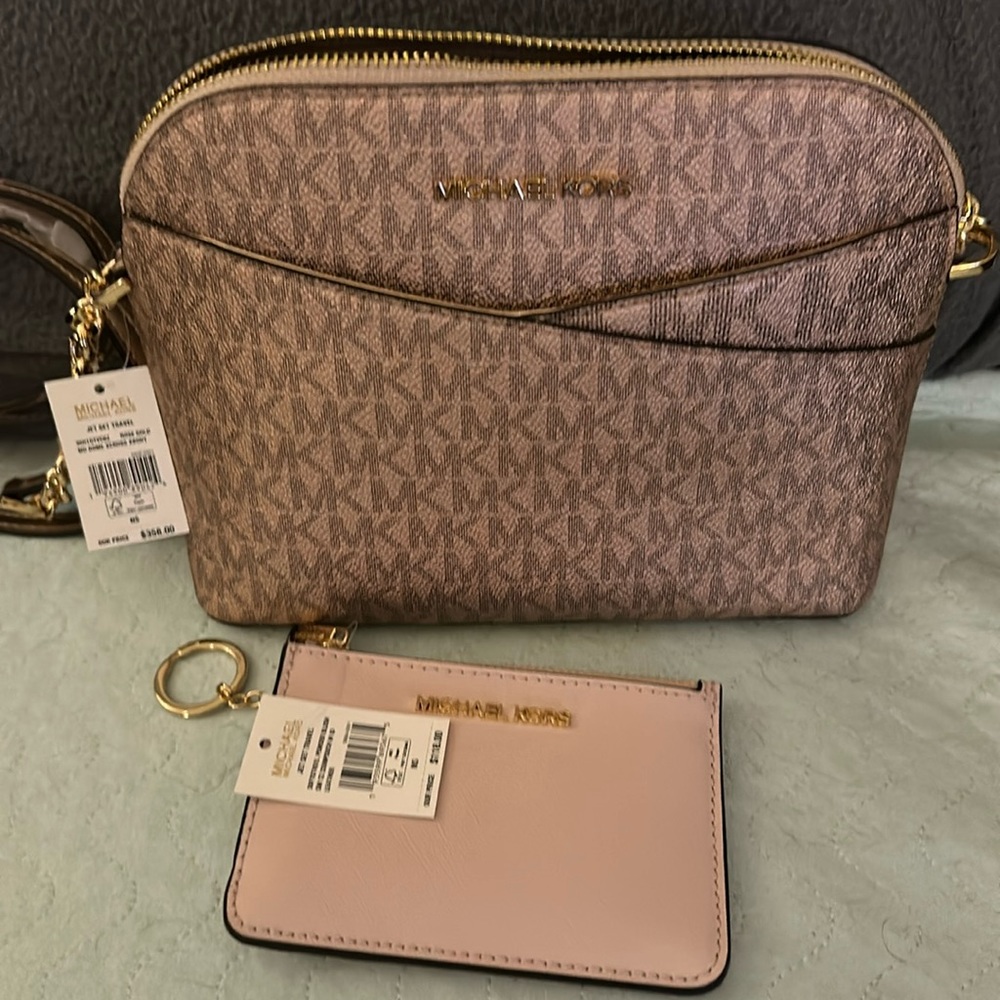 Part of MK Jet set line. Pink and gold shiny and pink card holder. Sold as a set